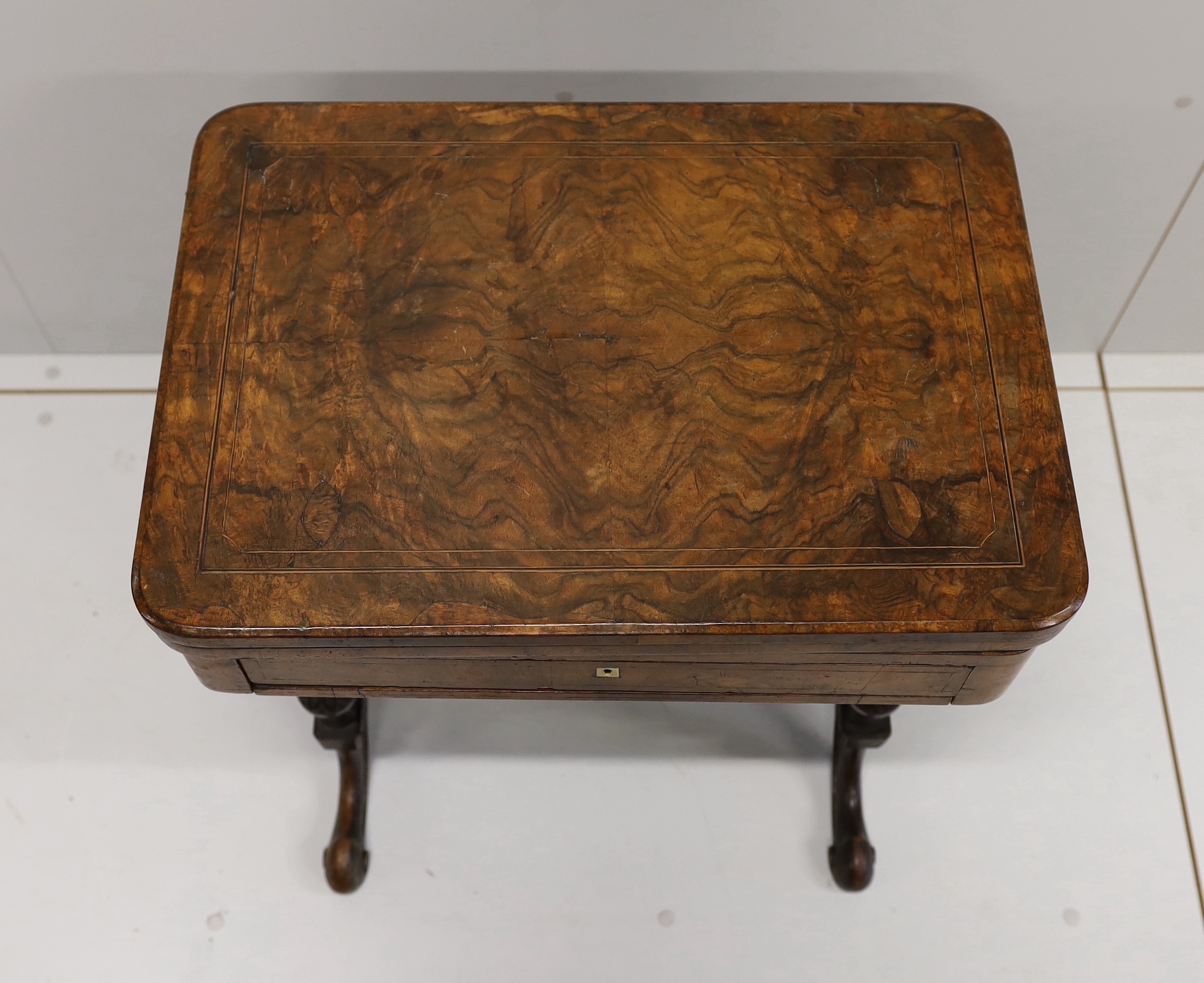 A Victorian figured walnut rectangular sewing / games table, width 58cm, depth 41cm, height 69cm